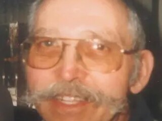 John E. Helbig Obituary